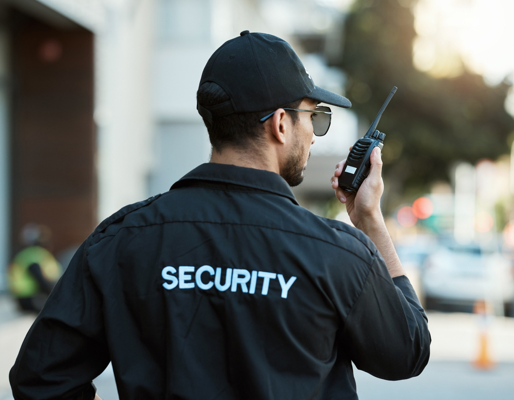 Bouncer providing security at night club entrance